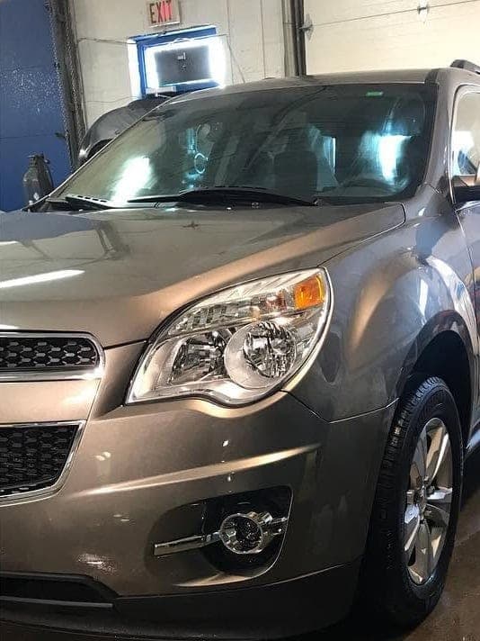 The same Equinox in our shop with the front bumper, headlight and fender repaired